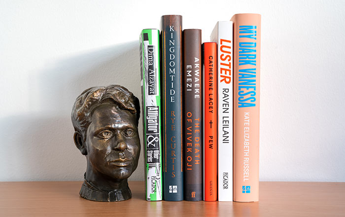 The six shortlisted books with bust of Dylan Thomas
