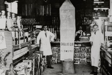 Photograph of interior of co-operative shop with advert for chocolate club