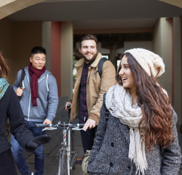 Students chatting walking through Singleton Campus.