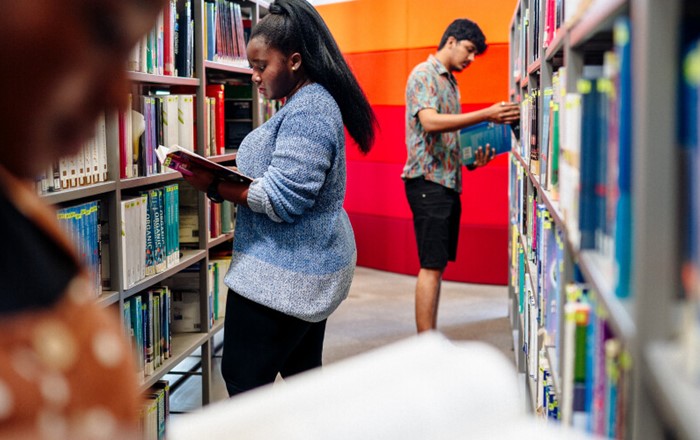 Students in Swansea University library: there will be up to 70 of the new scholarships available each year.