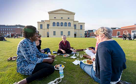 Picnicking on the lawn behind the Great Hall during the British Gerontology Conference
